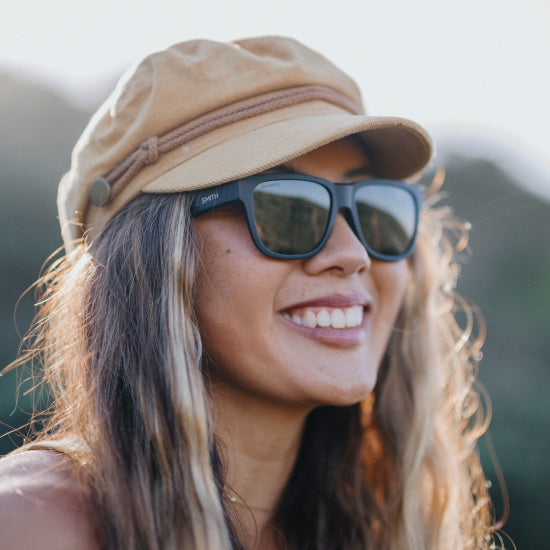 A woman smiles while wearing Smith Lowdown Slim 2 Sunglasses.